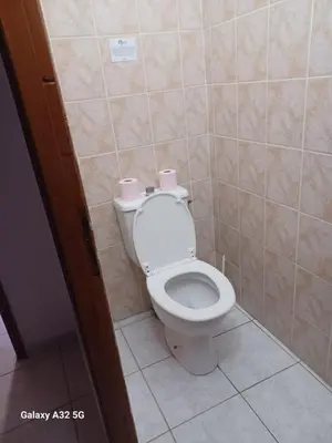 a bathroom with a toilet with two rolls of toilet paper at Residence les Lavandes in Olmeto