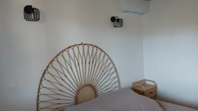 a bedroom with a large fan on the wall at Casapiana 7 in San-Gavino-di-Carbini