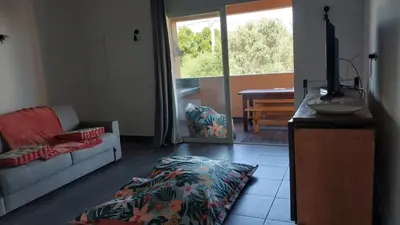a living room with a couch and a table at Casapiana 7 in San-Gavino-di-Carbini