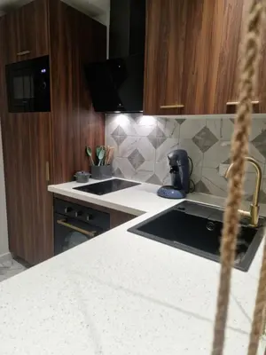 a kitchen with a sink and a counter top at Charmant Appartement Centre-Ville d'Ajaccio in Ajaccio