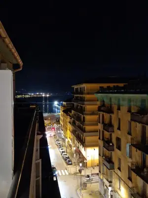 a night view of a city street with buildings at Charmant Appartement Centre-Ville d'Ajaccio in Ajaccio
