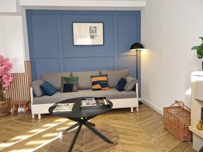 a living room with a couch and a table at Charmant Appartement Centre-Ville d'Ajaccio in Ajaccio