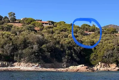 a house on top of a hill next to the water at Villa panoramic - Dream and Suite Lodge in Vico