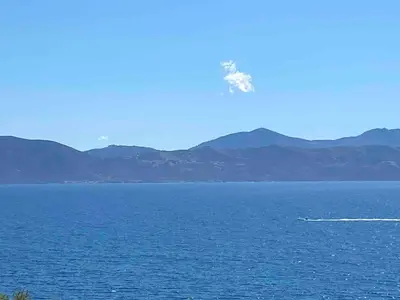 a boat in the middle of a large body of water at Sagone villa sea view in Vico