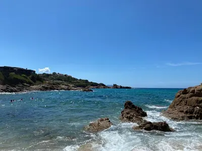 a group of people in the water at the beach at Sagone villa sea view in Vico