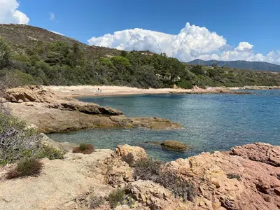 a body of water with rocks and a beach at Sagone villa sea view in Vico