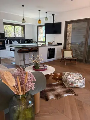 a living room with a dog laying on the floor at Casa Raphael in Ajaccio