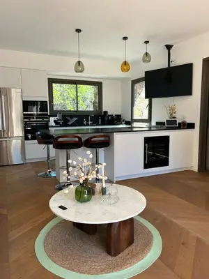 a kitchen with a table in the middle of a room at Casa Raphael in Ajaccio