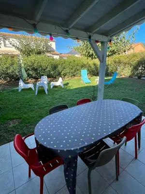 a polka dot table and chairs on a patio at Casabella 3 chambres in Cervione