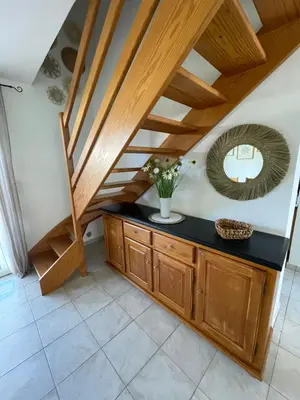 a staircase with a mirror and a counter in a room at Casabella 3 chambres in Cervione