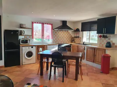 a kitchen with a table and a kitchen with a dishwasher at Appartement Appietto in Appietto