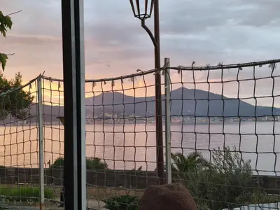 a view of the ocean from a window at CHALET de la plage in Porticcio