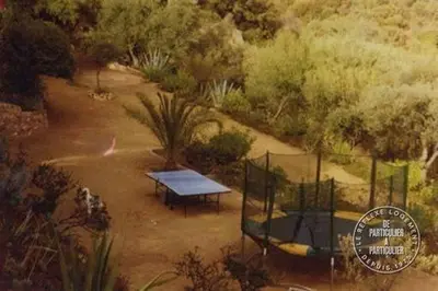 an overhead view of a park with a bench at Villa Pierre Vergerie in Cargèse