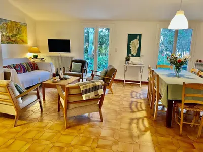 a living room with a couch and a table at Villa Nausicaa in Pietrosella