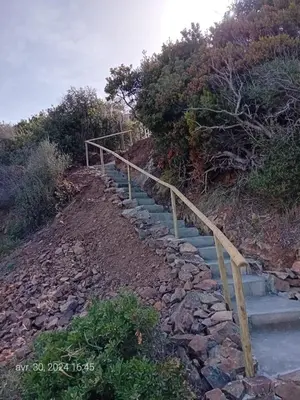 a set of stairs on the side of a hill at Crique privée in Conca