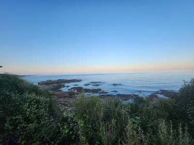 a view of the ocean from a hill at Crique privée in Conca