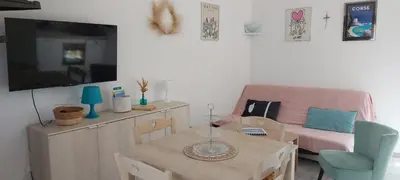 a hallway with a staircase with a tv on a wall at Porto Vecchio - Résidence RIVIERA- Villa Bonifacio in Lecci