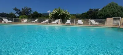 a kitchen with a sink and a washer and dryer at Porto Vecchio - Résidence RIVIERA- Villa Bonifacio in Lecci