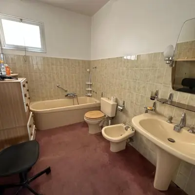 a bathroom with a tub and a toilet and a sink at Beautiful T4 apt with a view of the Gulf d'Ajaccio in Ajaccio