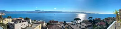 a view of a large body of water with buildings at Beautiful T4 apt with a view of the Gulf d'Ajaccio in Ajaccio