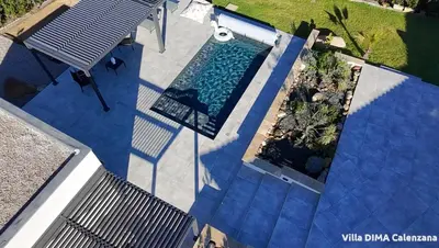 an overhead view of a swimming pool in a house at Villa DIMA - piscine chauffée climatisation barbecue pétanque in Calenzana