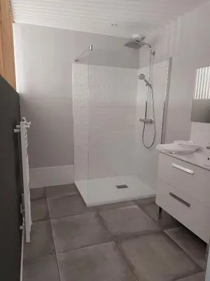 a white bathroom with a shower and a sink at Rondinara Camara - Lecci Lodge in Lecci