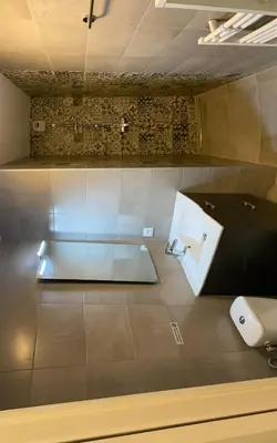 a bathroom with a toilet and a sink at Villa résidence avec piscine chauffée Bonifacio in Bonifacio