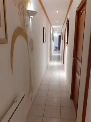 a hallway with white walls and a tile floor at Villa conviviale à Olmeto avec piscine privée in Olmeto
