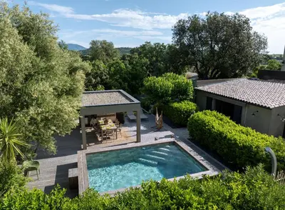 an overhead view of a swimming pool in a yard at Villa Les Granges Classé 5 Étoiles in Antisanti