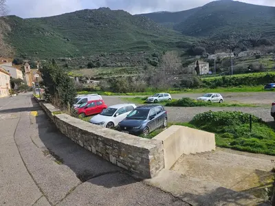 a group of cars parked in a parking lot at Casa di JF in Olmeta-di-Tuda