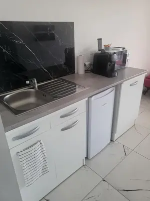 a kitchen with a sink and a counter top at Solenzara T2 rez de villa, vue mer, proximité plage et village in Sari Solenzara