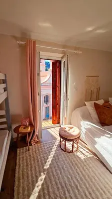 a bedroom with a bed and a large window at Splendide T2 Piana in Piana