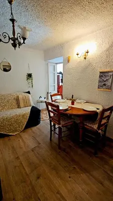 a living room with a table and a bed at Splendide T2 Piana in Piana