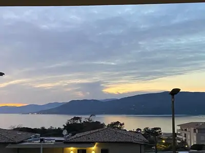 a view of a lake with mountains in the background at Superbe T3 vue mer in Propriano