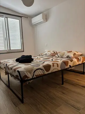 a large bed in a room with a window at Casa Straboni Corte in Corte