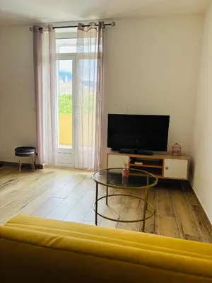 a living room with a tv and a coffee table at Casa Straboni Corte in Corte