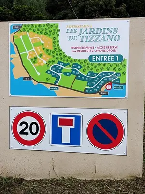 a sign for a park with a map at Villa individuelle avec jardin in Sartène