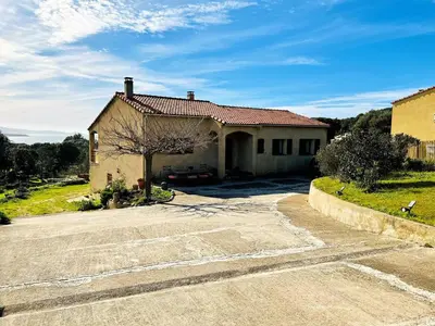 a house with a driveway in front of it at CasaCampanile in Olmeto
