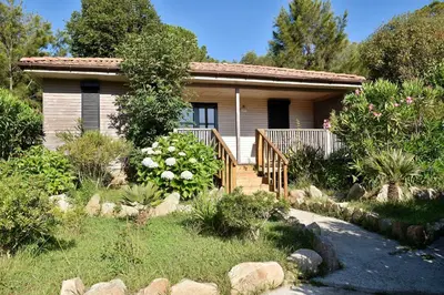 a small house with a garden in front of it at Résidence & Hotel U Livanti ECOLABEL in Propriano