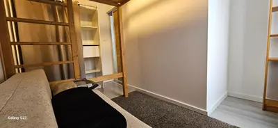 a room with a couch and some shelves at Maison Quenza Corse-du-Sud in Quenza