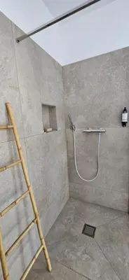 a bathroom with a white sink and a mirror at Hôtel Résidence de standing Casa Pian d'Olmo in Olmiccia