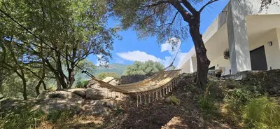 a swimming pool with two lounge chairs next to at Hôtel Résidence de standing Casa Pian d'Olmo in Olmiccia