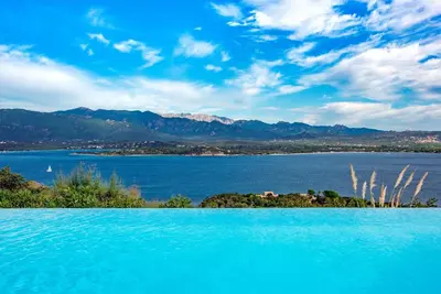 an island in the middle of a large body of water at Les Hauts de Pavellone in Porto-Vecchio