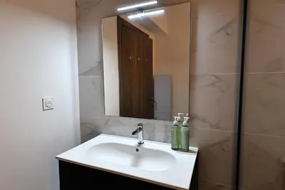 a bathroom with a sink and a mirror at La Parenthèse Corse - T2 cabine vue mer in Pianottoli-Caldarello