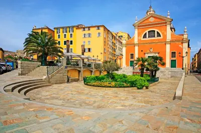 a building with a clock tower in a city at Grand T2 Cours Napoléon A in Ajaccio