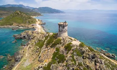an island in the ocean with a lighthouse on it at Grand T2 Cours Napoléon A in Ajaccio
