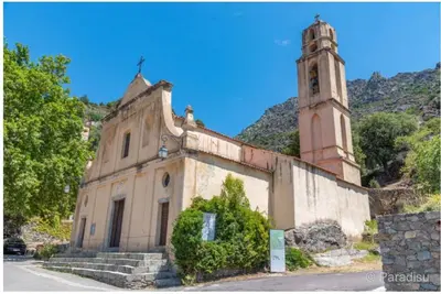 an old church with a clock tower on a hill at L'Olivella in Lama
