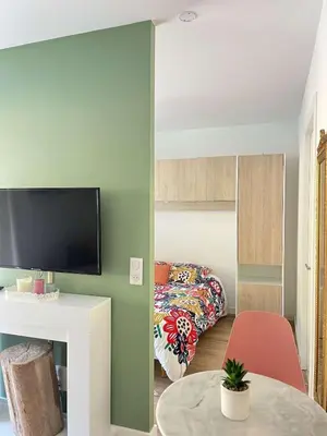 a living room with a bed and a table at Casa PANGRANI in Ajaccio