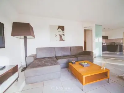 a living room with a couch and a coffee table at Casa Ghjuvanna in Propriano
