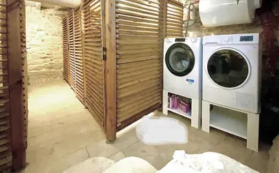 a laundry room with a washer and dryer at Appartement citadelle Bonifacio Appolonie in Bonifacio
